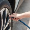 Person filling up their tire